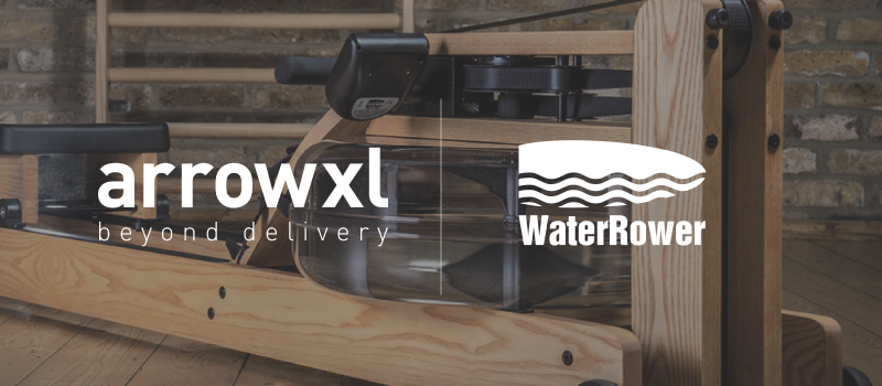 ArrowXL and WaterRower logo over an image of a rowing machine